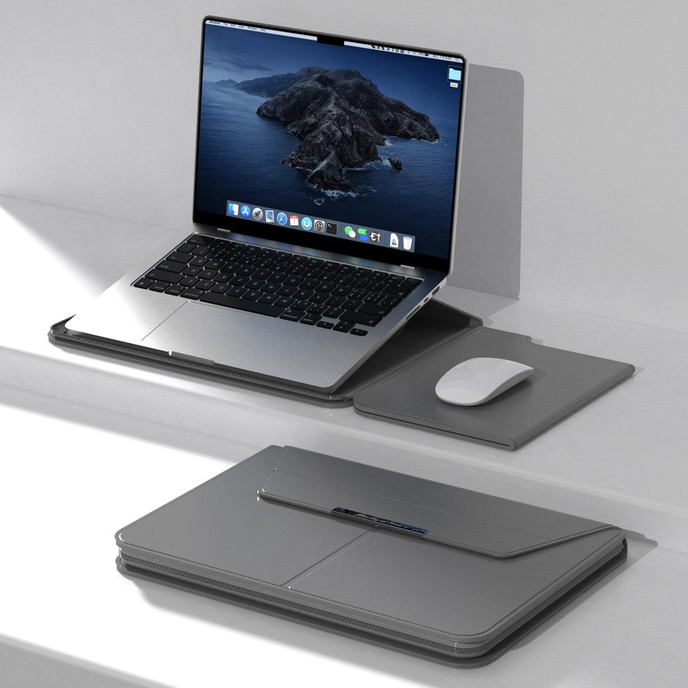 Gray Laptop sleeve with Zipper open, laptop propped on the fold-out stand half beside a mouse on the built-in mouse pad half, zipper trim visible along the edge