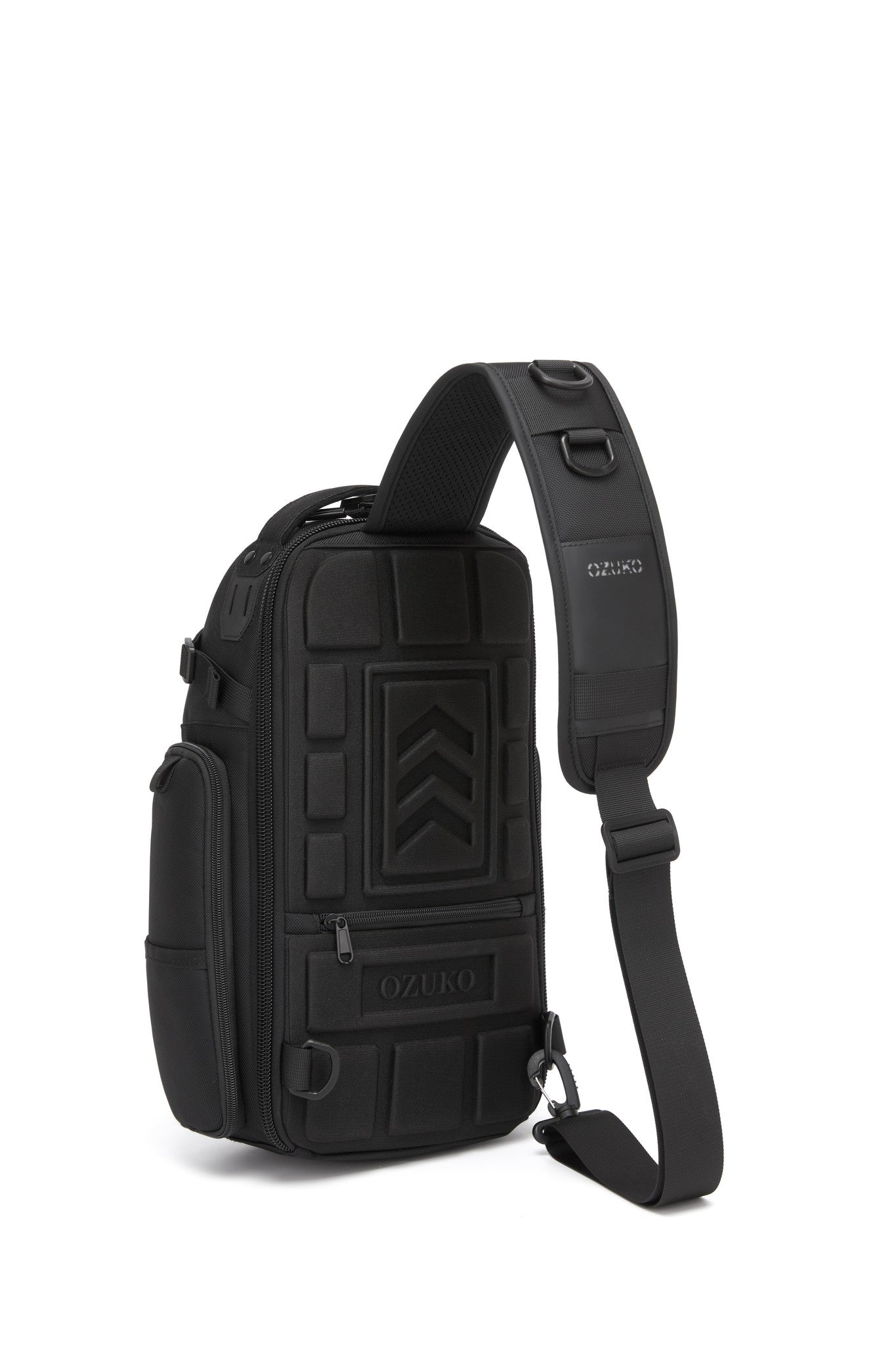 Ridge Sling Backpack 12L in Black - back view showing the molded armor-plated panel and adjustable sling strap with D-rings