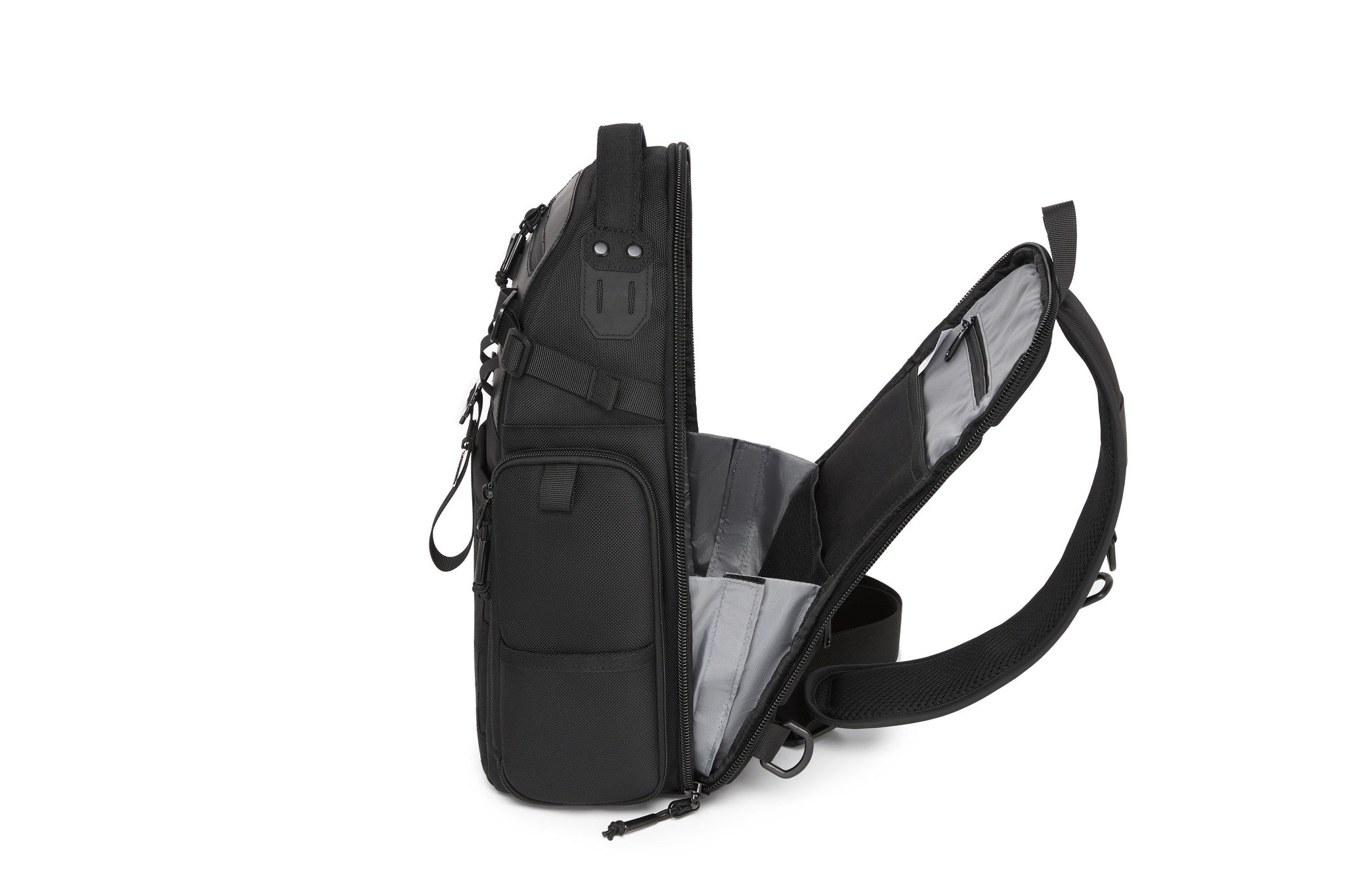 Ridge Sling Backpack 12L in Black - open side view showing the main compartment and interior organizer panel
