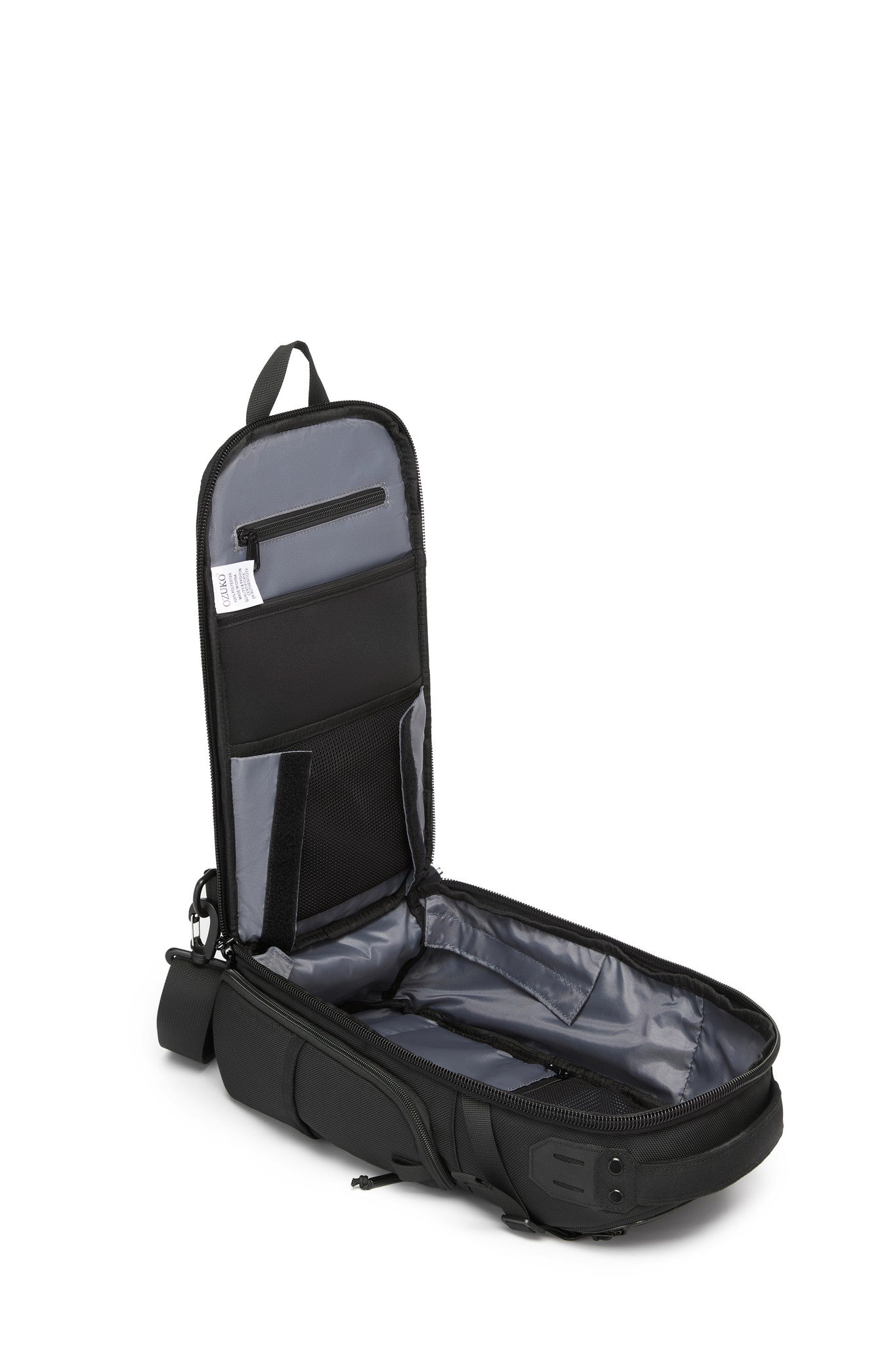 Ridge Sling Backpack 12L in Black - open side view showing the empty interior organizer panel with zip mesh pocket