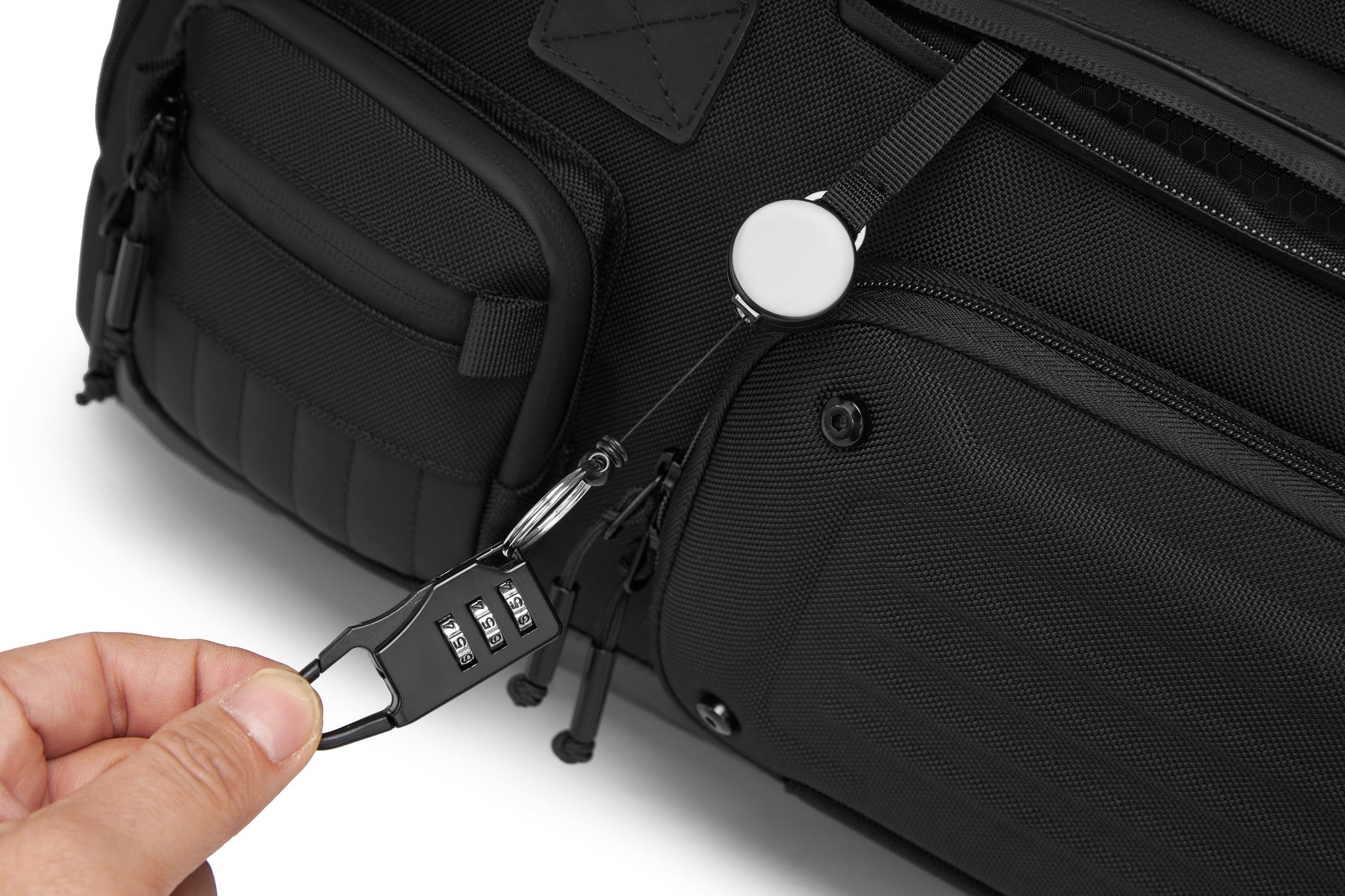 Close-up of the Oono Voyager Duffel 50L's built-in 3-digit combination lock securing the main zipper