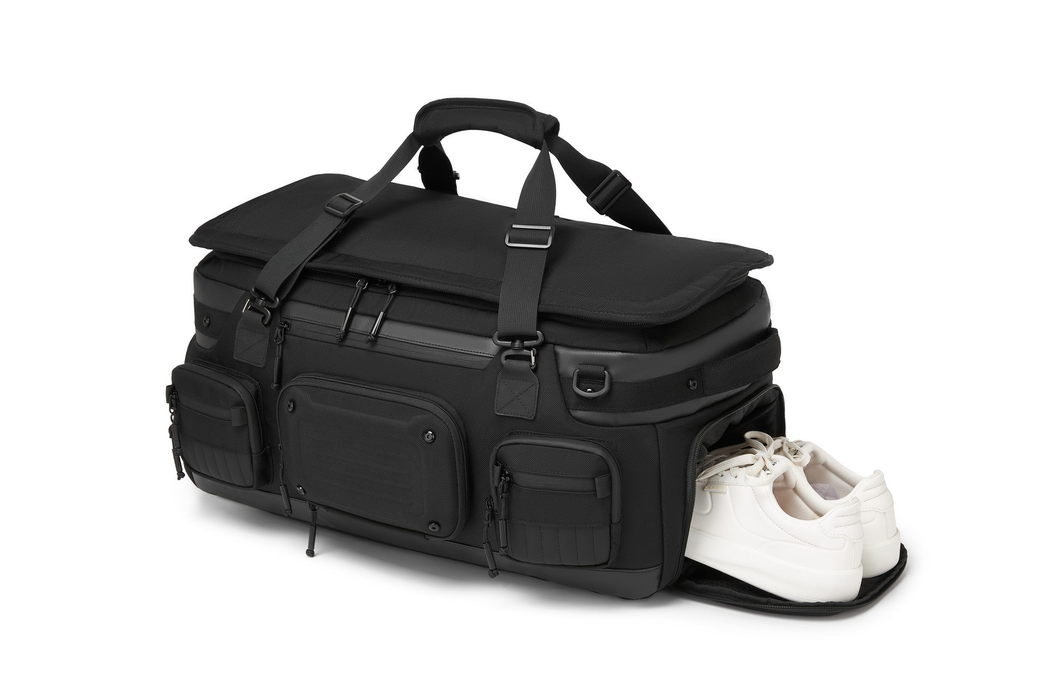 Oono Voyager Duffel 50L in black, side view with the dedicated bottom shoe compartment open and a pair of sneakers inside