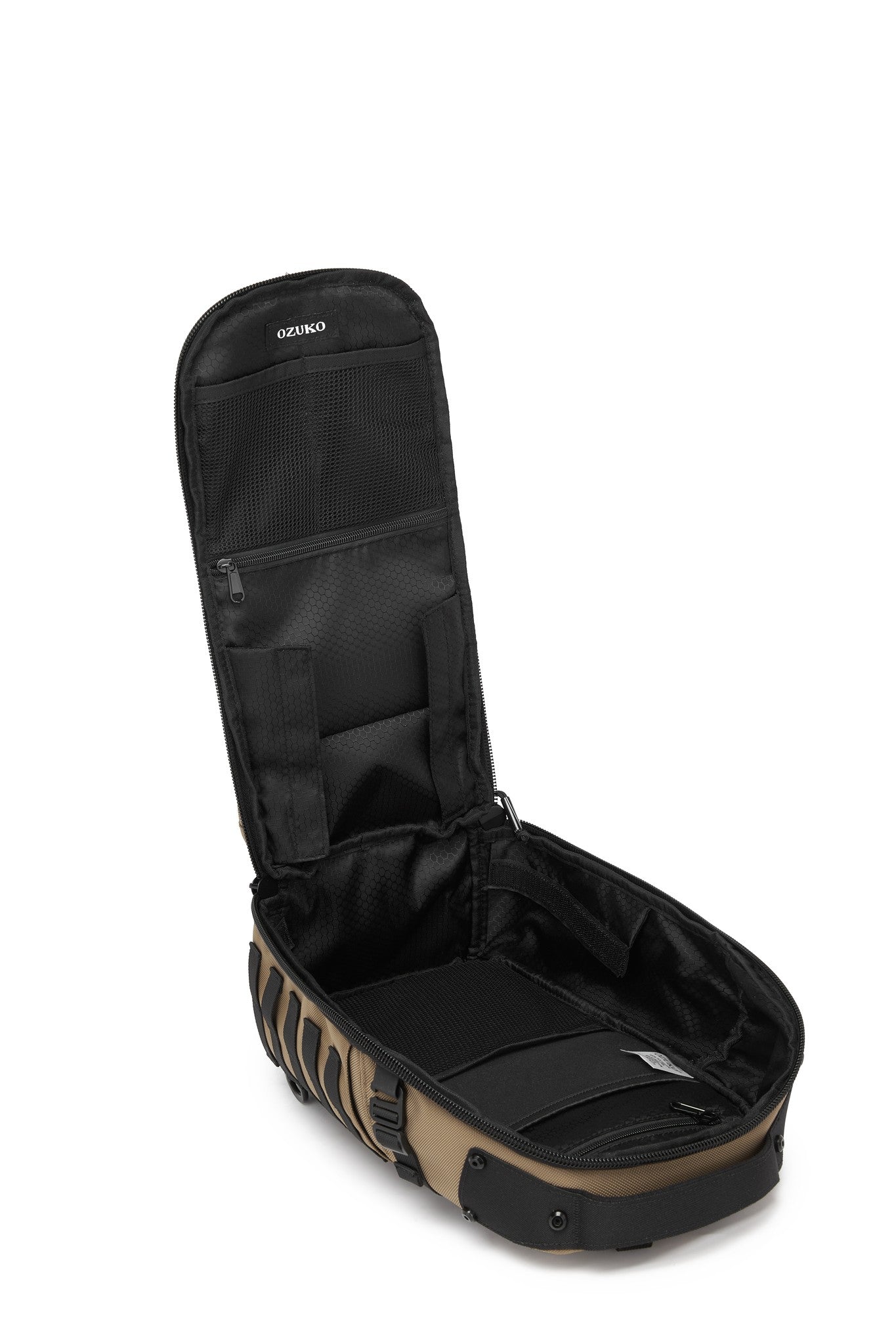 Daytrip Backpack 12L in Tan - open side view showing the empty interior lid pockets and main compartment
