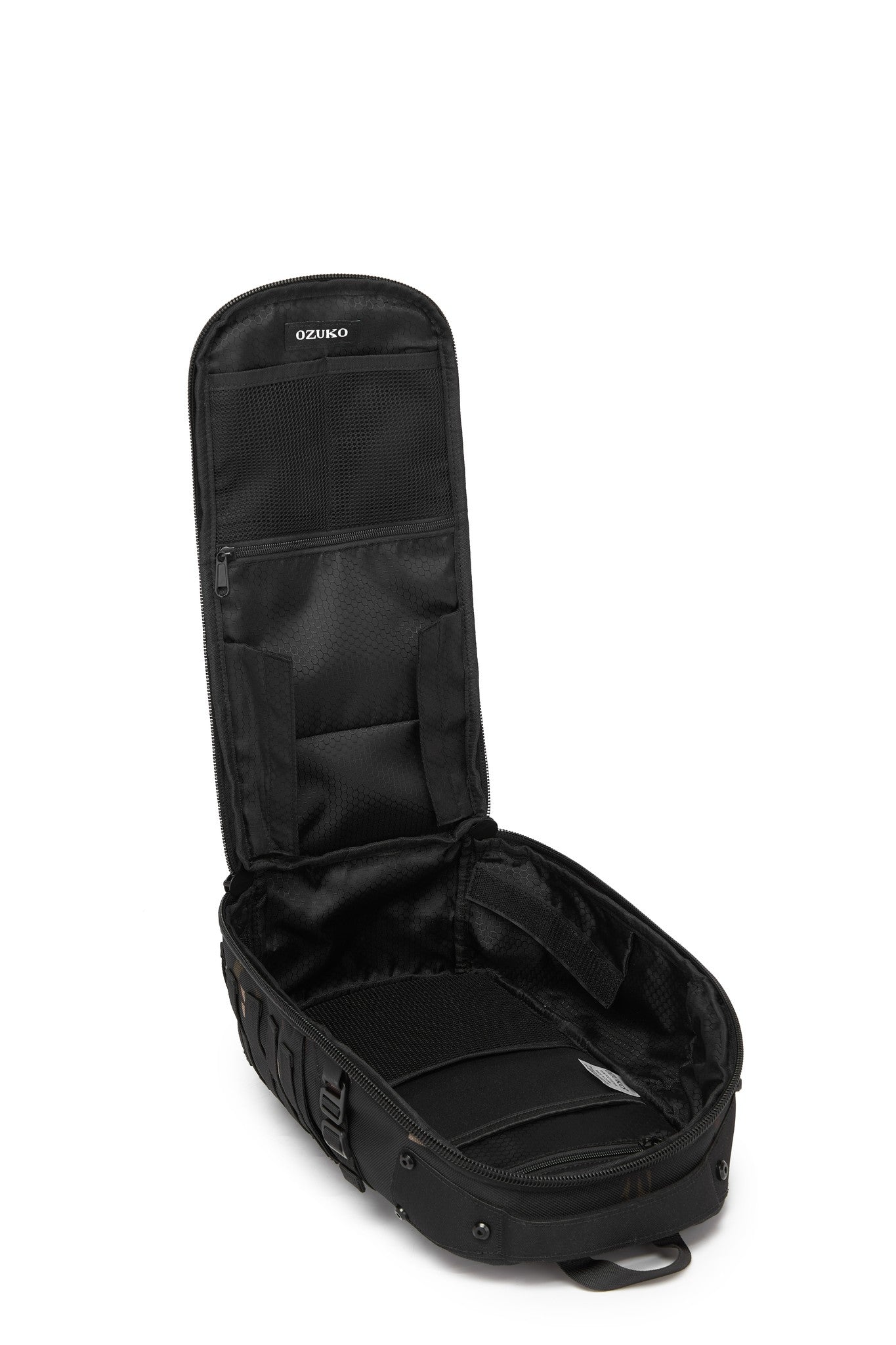 Daytrip Backpack 12L in Black - open side view showing the empty interior lid pockets and main compartment