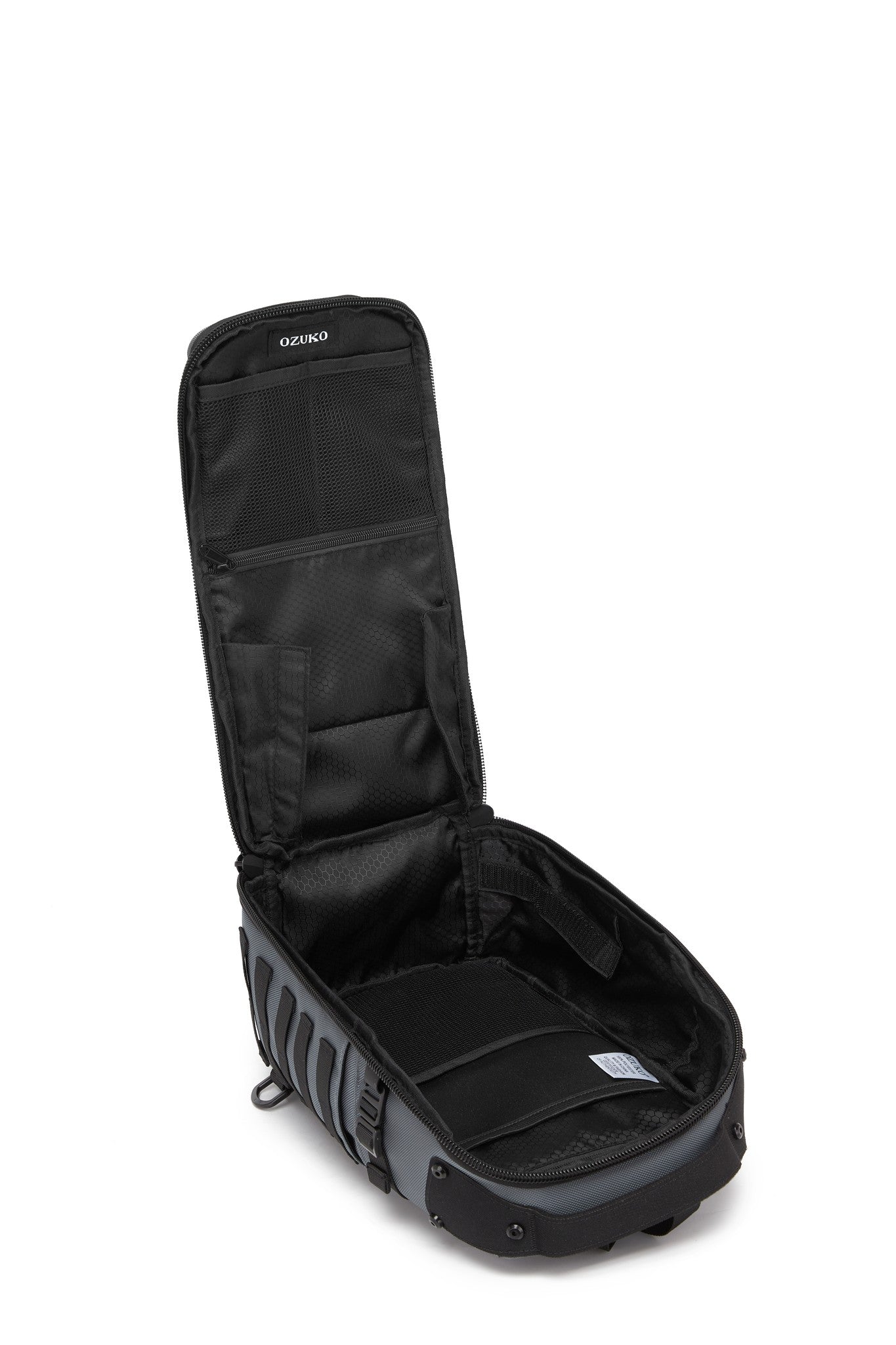 Daytrip Backpack 12L in Gray - open side view showing the empty interior lid pockets and main compartment