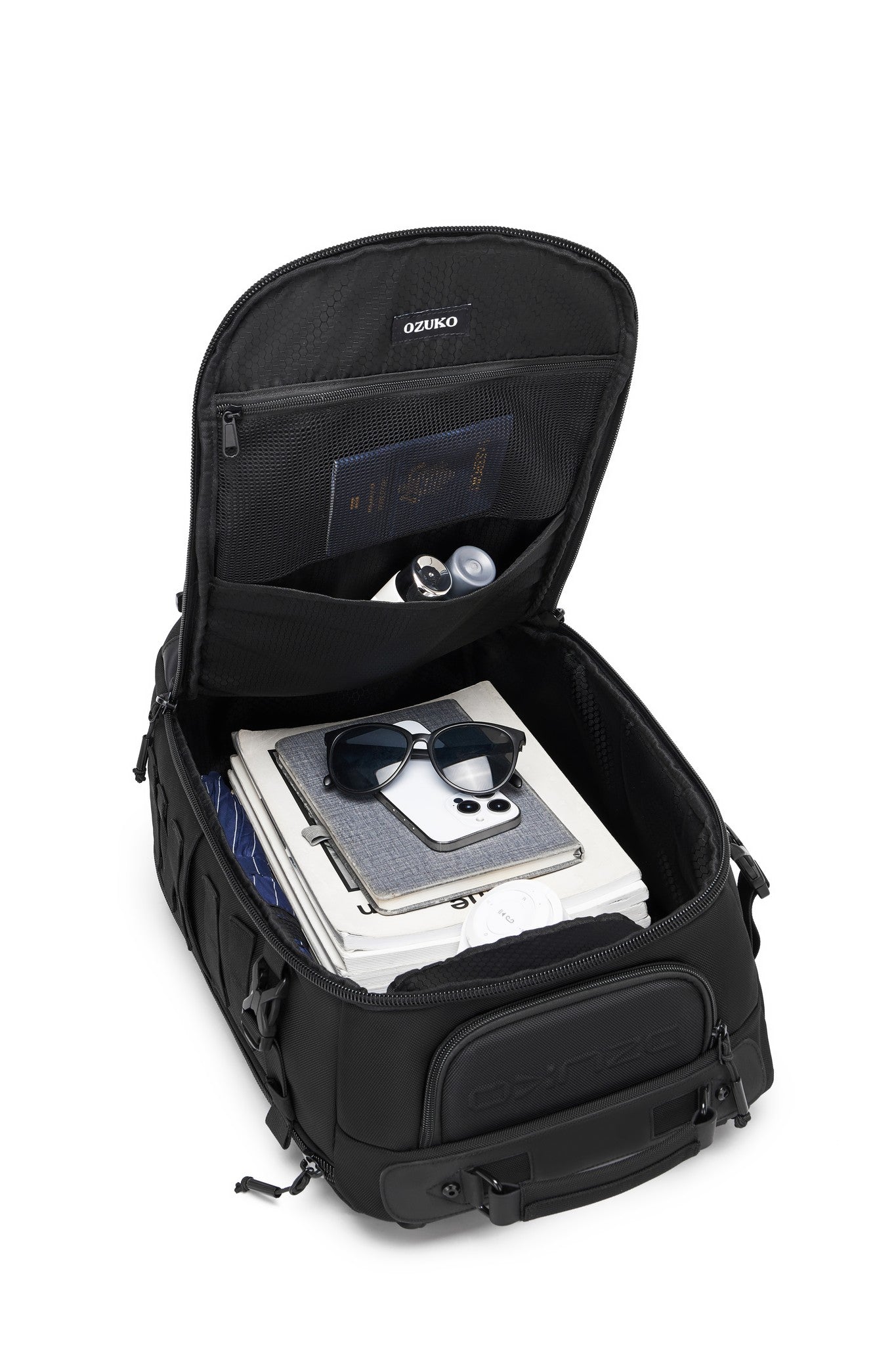 Close-up of the Oono Trailhead Backpack 25L's top pocket holding a pair of sunglasses